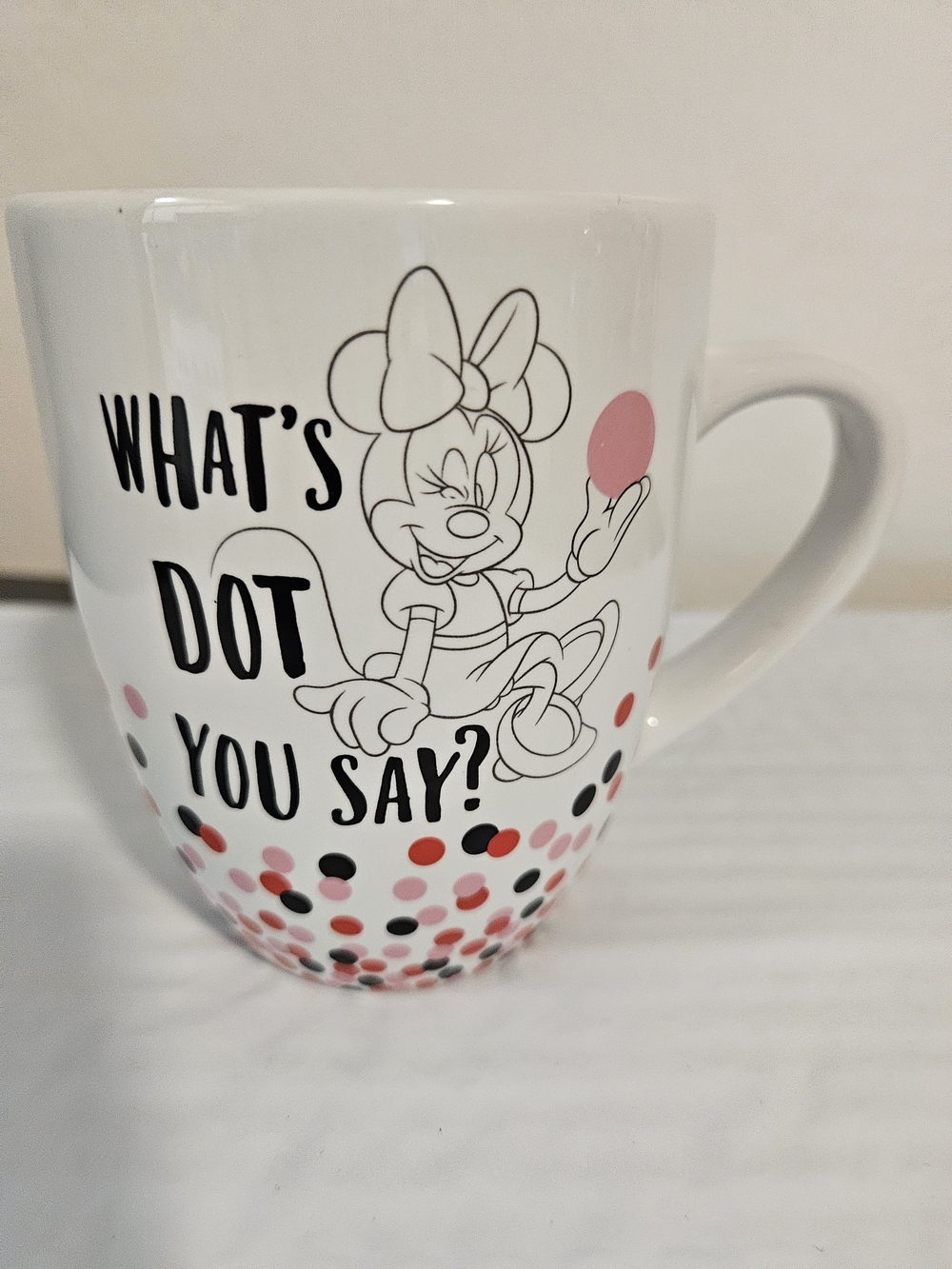 Disney Store ceramic coffee mug featuring a Minnie Mouse "What's Dot You Say?"